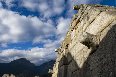 Low angle view of castle against cloudy sky