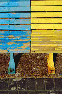  view of empty yellow and blue bench