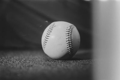 Close-up of baseball ball black and white