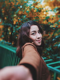 Close-up portrait of a smiling young woman