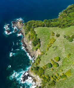 High angle view of cliff by sea 