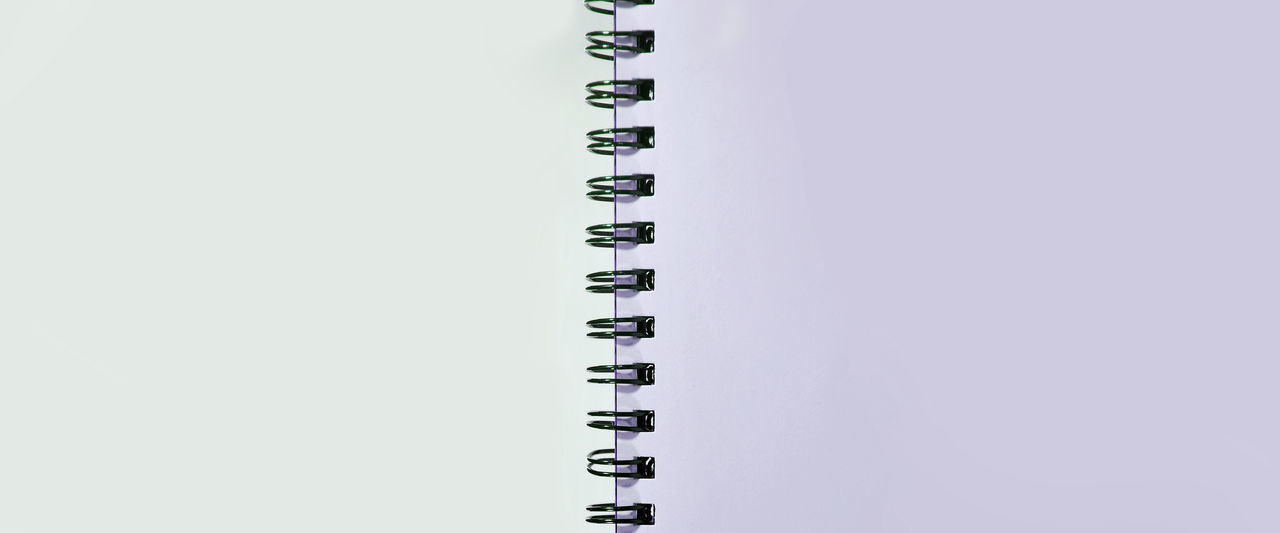 HIGH ANGLE VIEW OF PAPER AND WHITE BACKGROUND