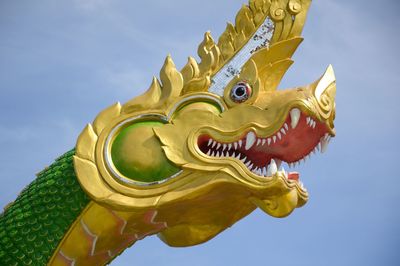 Low angle view of chinese dragon against clear sky