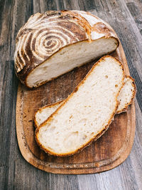 High angle view of chopped bread on cutting board