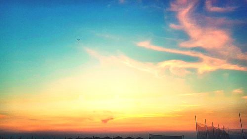 Low angle view of dramatic sky during sunset