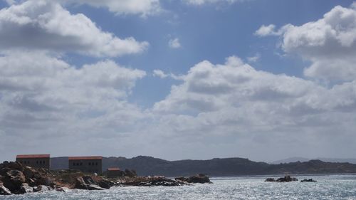 Scenic view of sea against cloudy sky