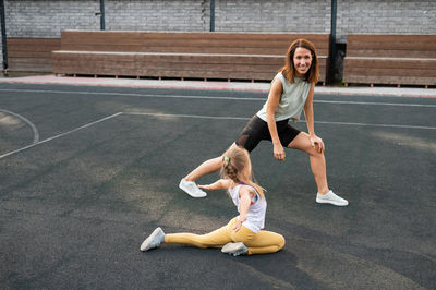 Full length of woman exercising in gym