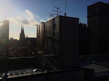 Buildings in city against sky