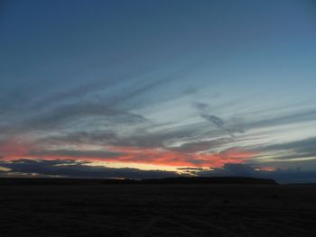 Scenic view of silhouette land against sky during sunset