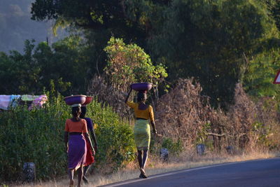 Rear view of people on golf course