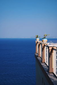 Scenic view of sea against clear blue sky