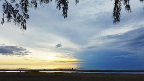 Scenic view of beach against sky during sunset