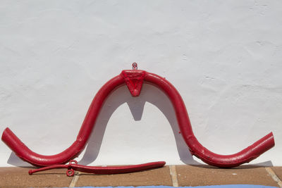 High angle view of red umbrella against wall