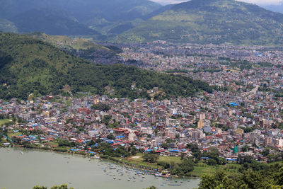 High angle view of townscape and mountains