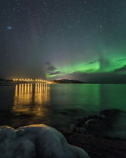 Scenic view of sea against sky at night