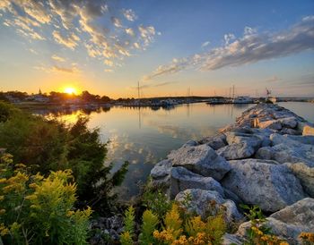 Scenic view of lake against sky during sunset