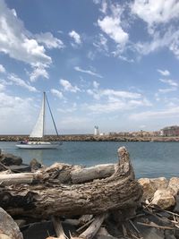 Sailboat on sea against sky