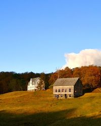 House on field against sky