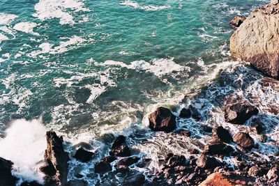 Waves splashing on rocks