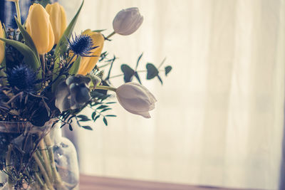 Close-up of flowers in vase at home