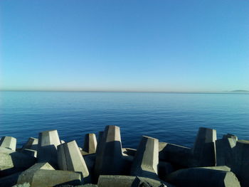 Scenic view of sea against clear blue sky