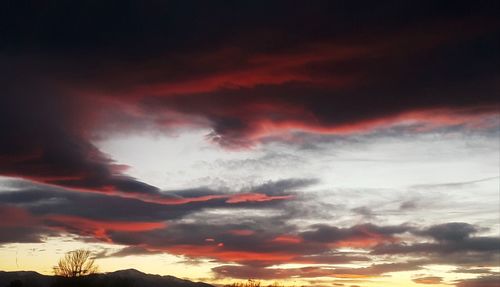 Low angle view of dramatic sky during sunset