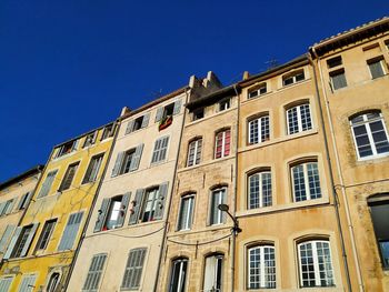  view of yellow shaded buildings and blue blue sky