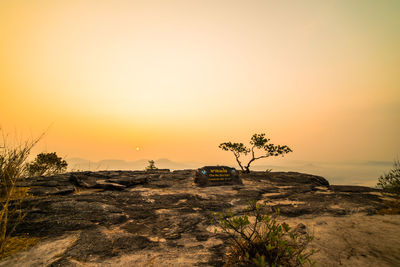 Scenic view of rocky landscape against sky during sunset