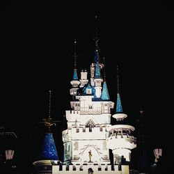 Low angle view of illuminated building at night