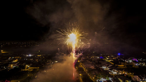 Low angle view of firework display at night