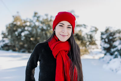 Portrait of smiling woman in snow