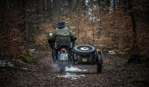 Rear view of man on motorcycle