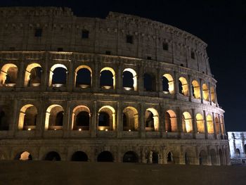 Low angle view of historical building at night