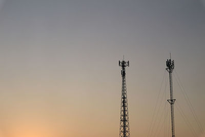 Colorful cloud with communication signal tower silhouette.