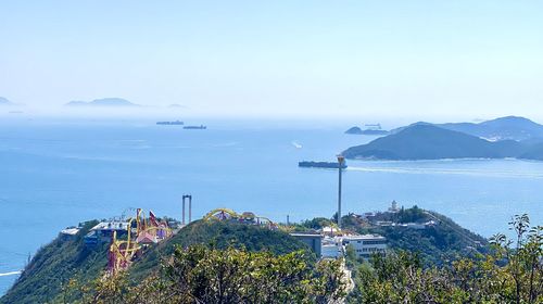 High angle view of sea and buildings against sky