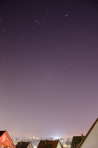 Low angle view of moon against blue sky