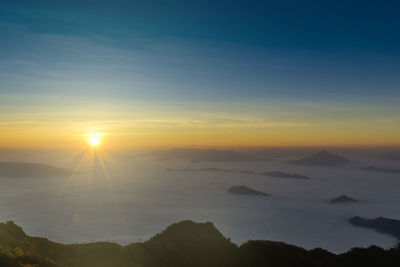 Scenic view of silhouette mountains against sky during sunset