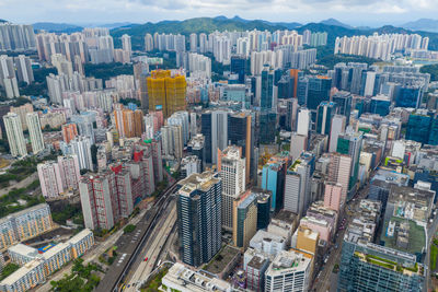 High angle view of buildings in city against sky