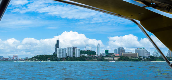 City by sea against sky