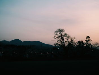 Scenic view of silhouette mountains against sky at sunset