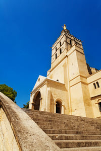 Low angle view of building against blue sky