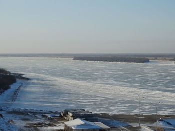 Scenic view of sea against clear sky during winter