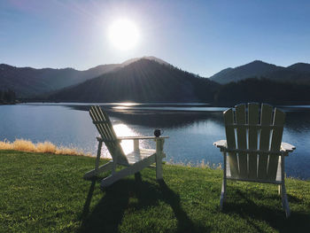 Scenic view of lake and mountains against clear sky