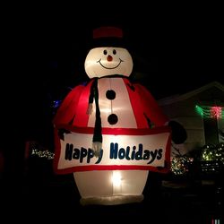 Low angle view of illuminated lights at night