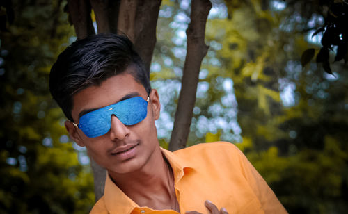 Portrait of young man in forest