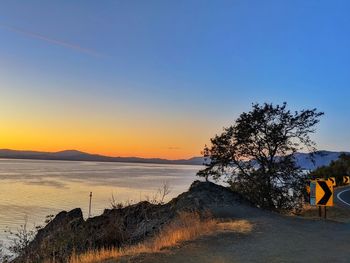 Scenic view of beach against sky during sunset