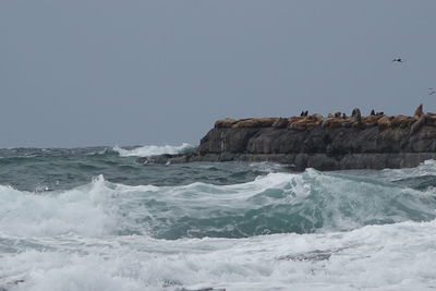 Scenic view of sea against cloudy sky