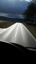 Empty road passing through landscape