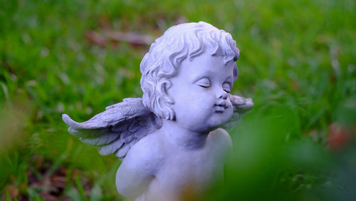 Close-up of angel statue in park