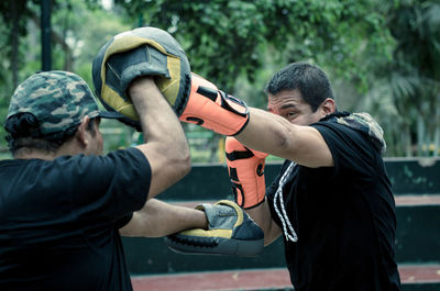 Man practicing boxing outdoors